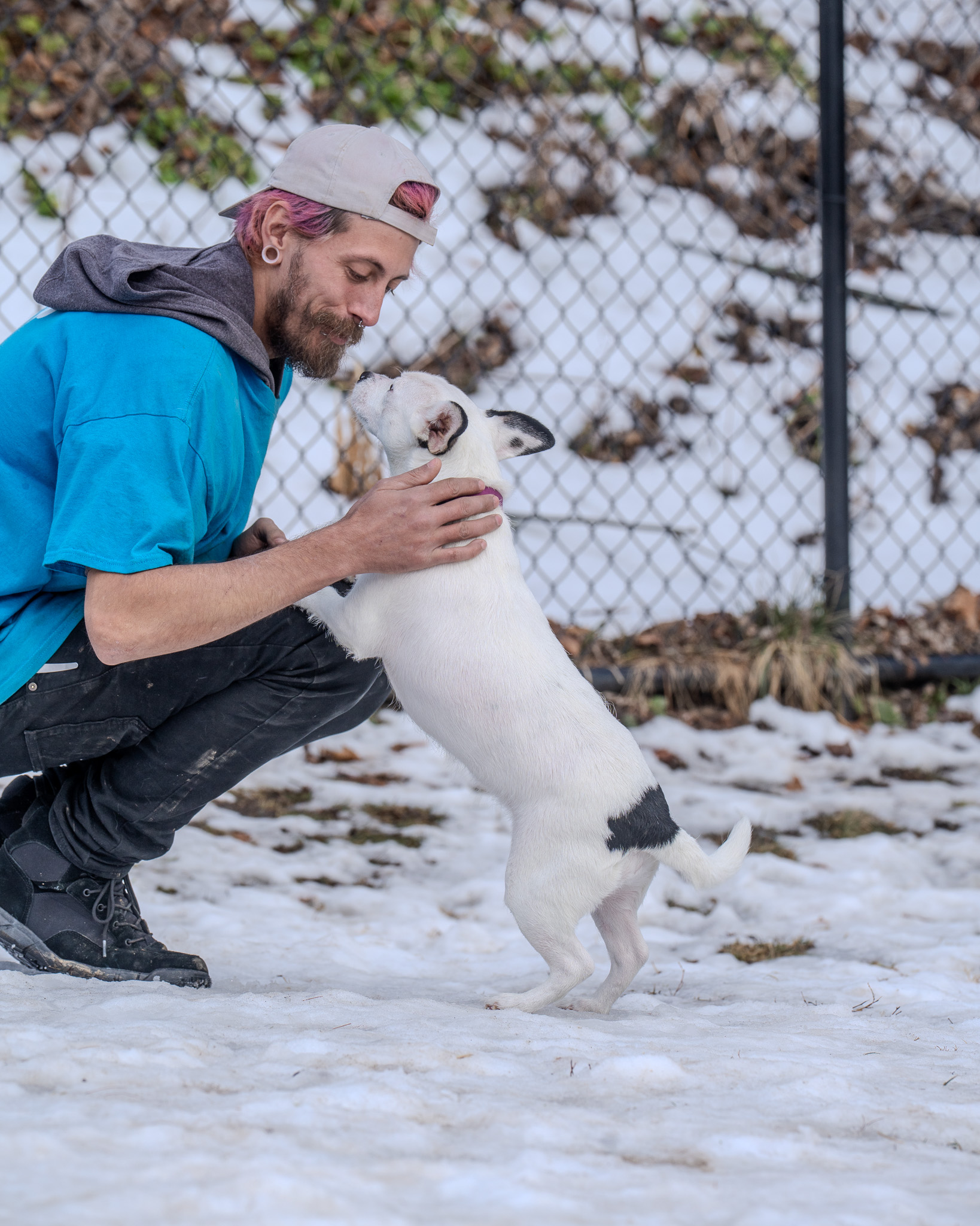 Volunteer providing animal care at Happy Life Animal Rescue