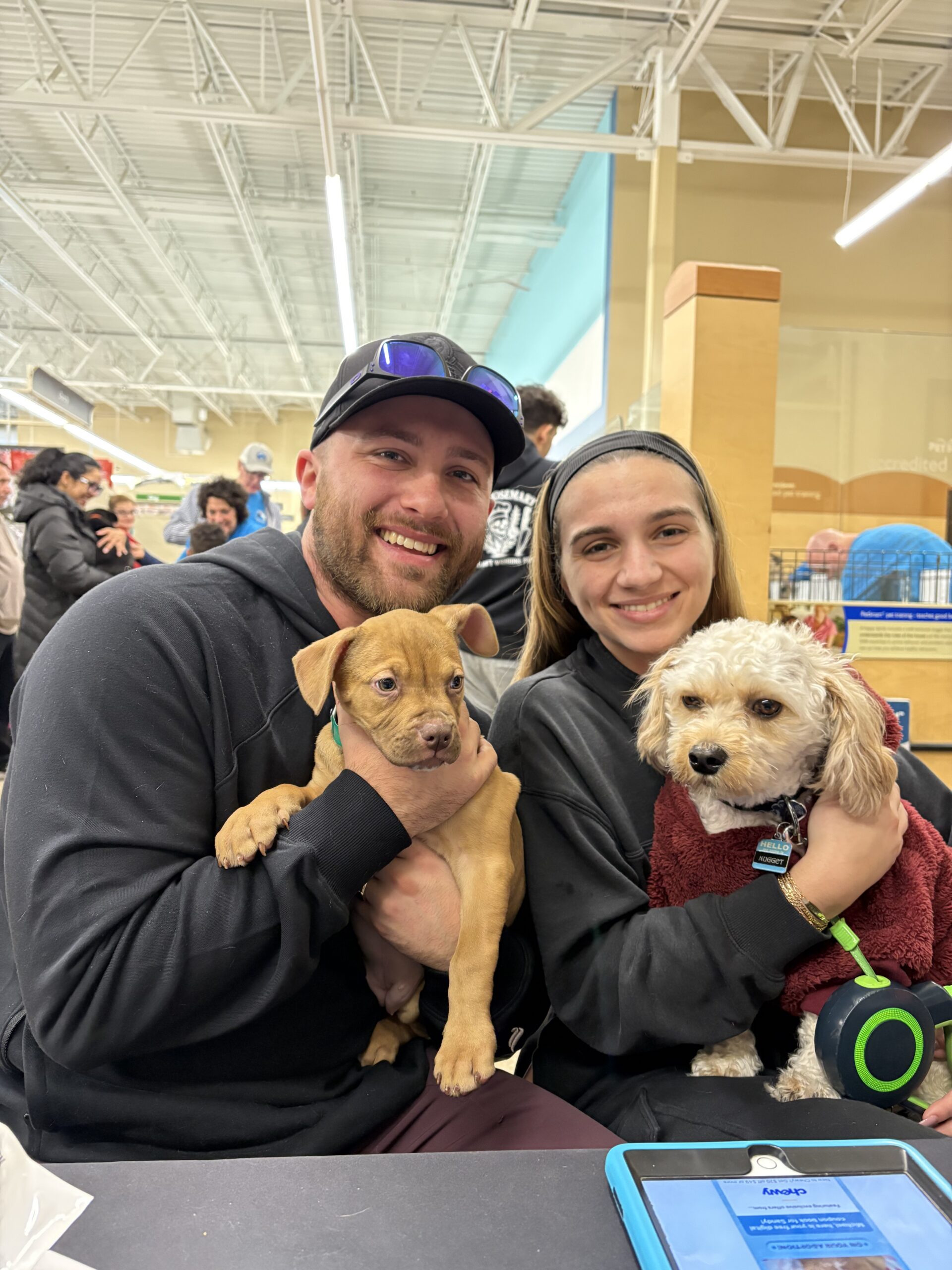 Happy adopters with their new dog from Happy Life Animal Rescue